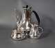 Coffee serving  set consisting of Coffee jug with Black Ebony handle, cream jug 
and sugar bowl, 830 s/hallmarked silver.
5000m2 showroom.